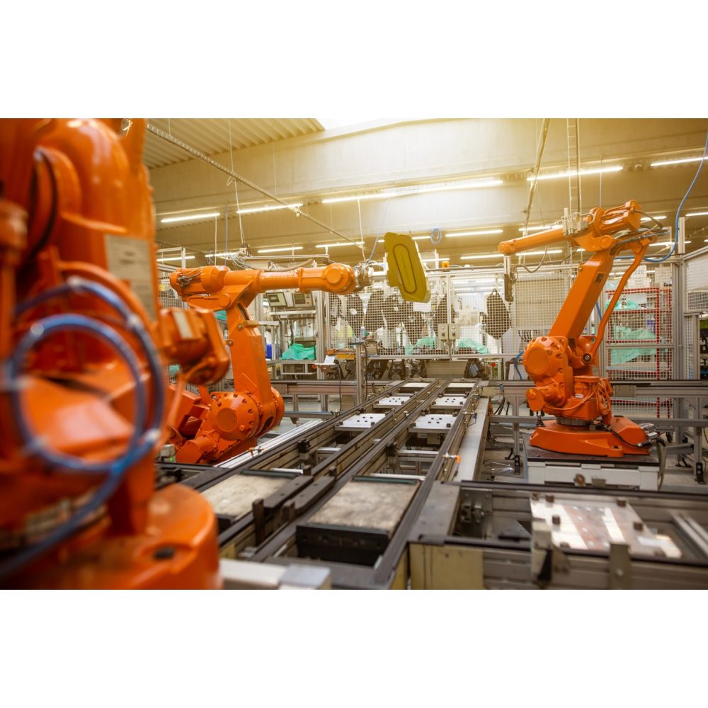 Robotic welding arm in a factory